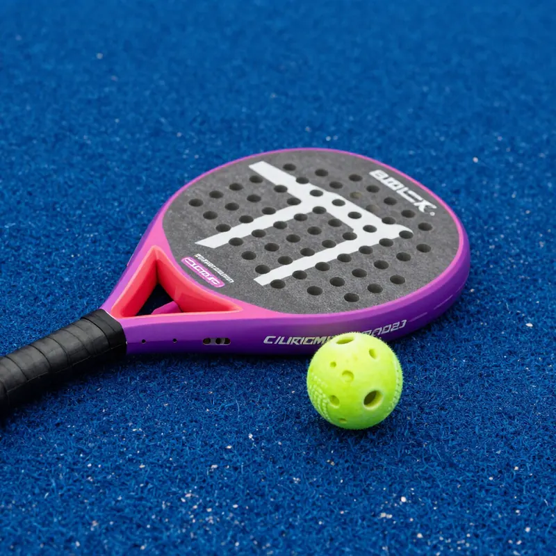 Padel racket and balls on court